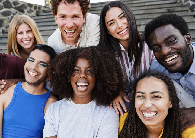 Group of young adults smiling and laughing