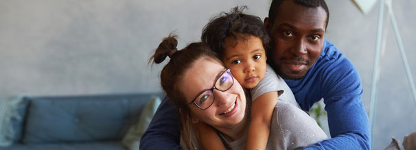 Husband and wife happy with child