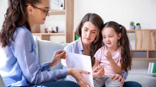 Support worker with mother and daughter