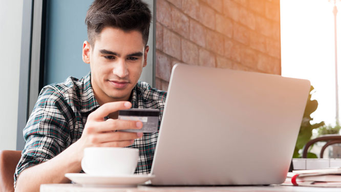 Teen looking at bankcard