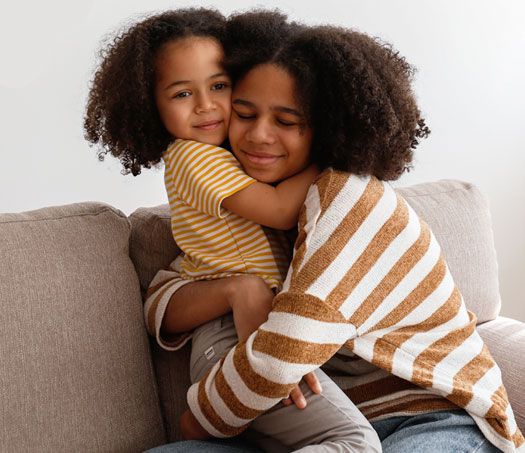 young woman and child hugging